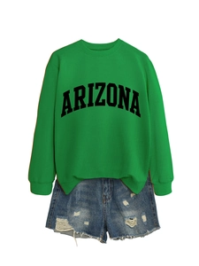 Close-up of green Arizona sweatshirt fabric texture and black letter printing detail