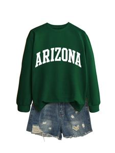 Detail view of dark green Arizona sweatshirt paired with distressed denim shorts