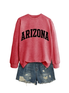 Detail of pink Arizona sweatshirt fabric texture and distressed denim shorts with frayed edges