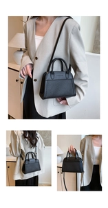 Detail of black shell bag featuring textured woven panels and polished leather accents
