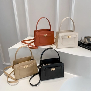 Minimalist square crossbody bags with turn-lock in orange, white, khaki, and black colors