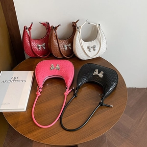 Retro crescent underarm bags with woven texture and metal bow details in five colors