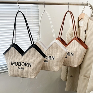 Three woven straw tote bags with MOBORN PARIS embroidery in black white and brown colors
