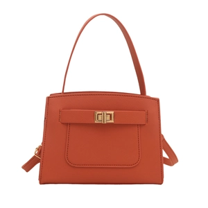 Minimalist terracotta square handbag with cross-grain texture and golden twist lock