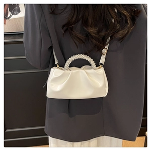 White cloud bag with pearl chain handle and pleated texture shown on model back