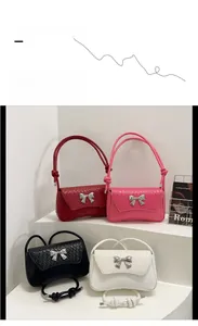 Four colorful handbags with woven textures and silver metal bows on a white platform