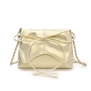 Pale yellow pearlescent shoulder bag with large bow detail and chain strap