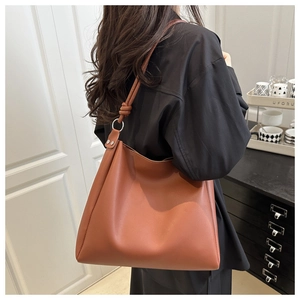 Large capacity brown faux leather hobo bag featuring a stylish knot strap detail