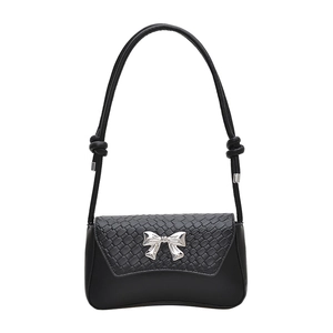 Minimalist black shoulder bag with woven texture and silver bow detail in a French style