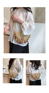Detail of handmade straw crossbody bag featuring ethnic tassels and beaded round ornament