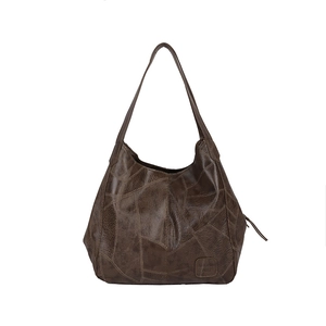 Vintage dark brown tote bag with geometric embossed leather and multiple compartments