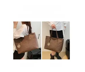 Detail view of brown leather tote bag showing shoulder and handbag carry styles