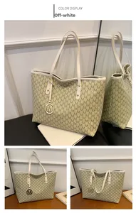 Detailed views of off-white tote bag featuring all-over M pattern and gold M pendant charm
