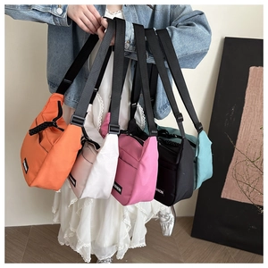 Nylon tote bags collection showing five colors with fashion rubber logo details