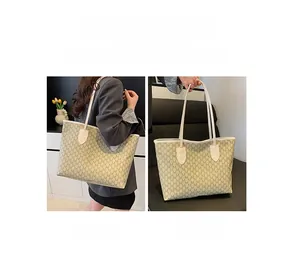 Detailed view of beige monogram tote bag with long straps for shoulder or hand carry