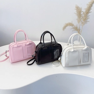 Three minimalist shell bowling bags in pink black and white with adjustable straps