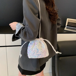 Iridescent sequin drawstring bucket bag with colorful shimmering effect and shoulder strap