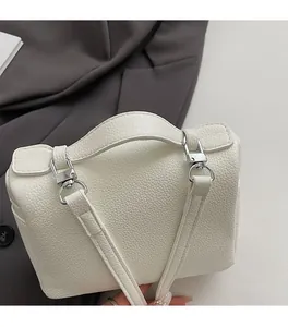 Detailed macro view of white lychee pattern leather and premium silver hardware buckle
