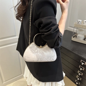 Elegant white floral embossed evening bag with golden metal handle and chain strap