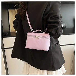 Lavender vanity case bag in lychee pattern leather with top handle and silver hardware
