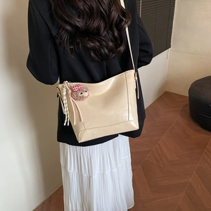 Chic cream large capacity tote bag with cute plush bear charm for daily commute