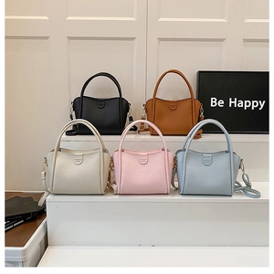 Detailed display of five color options for litchi grain leather handbags and straps