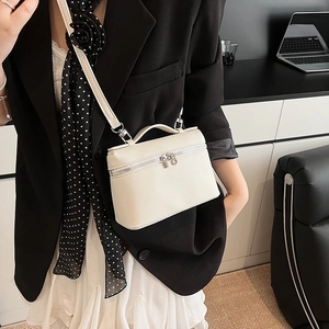 White lychee leather crossbody bucket bag with top handle and silver hardware
