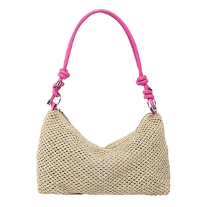 Fashionable straw woven tote bag with vibrant pink knotted handles and silver ring hardware