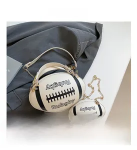 Detailed view of rugby-shaped crossbody bag with chain strap and matching mini coin purse