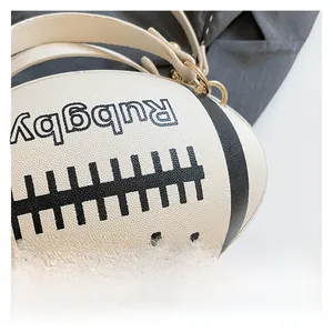 Close-up of litchi texture white rugby-shaped bag with gold hardware and chain strap