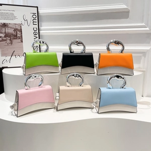 Minimalist hourglass shape shoulder bag with metallic handle in various vibrant colors