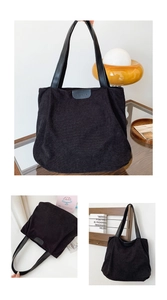 Detail of black corduroy tote bag with leather straps and central fashion logo patch
