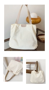 Detail of white corduroy tote bag showing soft ribbed texture and leather fashion tag