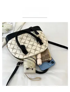 Detail view of the spacious interior of this retro black and white shell tote bag