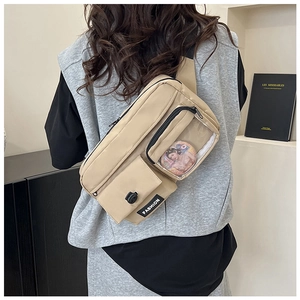 Close-up of khaki nylon chest bag featuring a PVC window with a cartoon badge