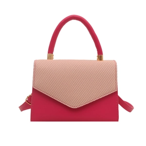Chic pink colorblock crossbody flap bag with textured weave and gold hardware