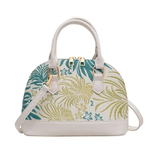 Chic shell-shaped handbag with tropical floral embroidery and vegan leather trim
