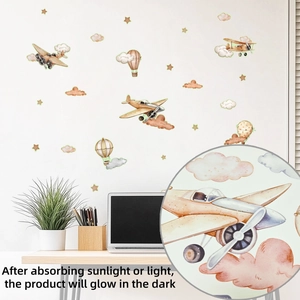 Detail of watercolor vintage planes and hot air balloons glow in the dark wall stickers