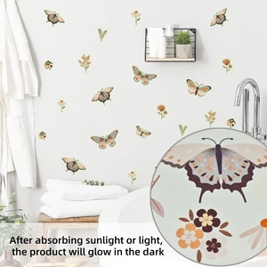 Detailed view of luminous butterfly and flower wall stickers glowing in a dark room
