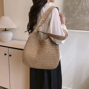 Minimalist straw tote bag with large capacity and woven shoulder strap for beach and travel