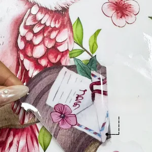 Detail of static cling window film with double-sided colorful bird and flower patterns