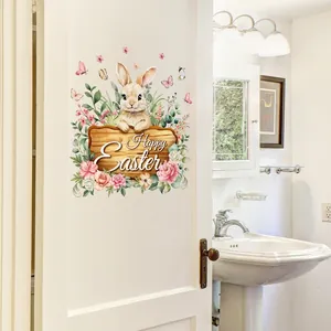 Watercolor Easter bunny wall decal with floral Happy Easter sign on white bathroom door