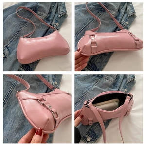 Detail view of pink glossy PU moon bag showing interior capacity and zipper closure