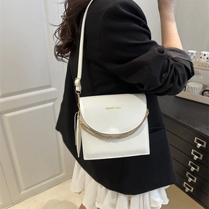 Minimalist white crossbody bag with gold double chain and fashion logo lettering
