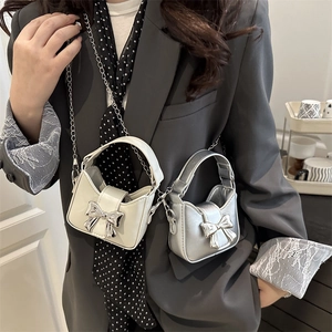 Mini bow crossbody bag with silver chain and handle in off-white and metallic silver