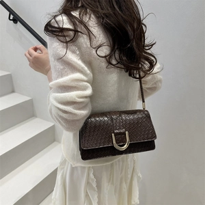 Retro deep brown baguette bag with animal embossed texture and gold horseshoe buckle