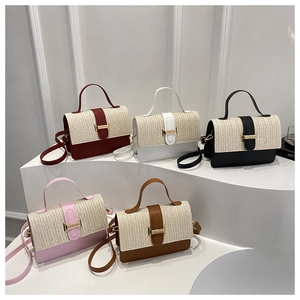 Close-up of stylish woven crossbody bags in five colors with leather trim and handles