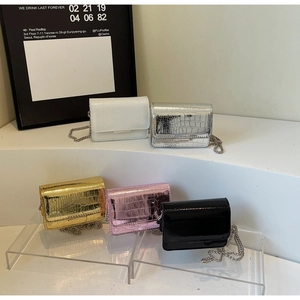 Collection of crocodile-embossed patent leather mini bags in multiple stylish colors
