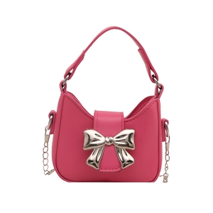 Mini rose pink crescent handbag with metallic silver bow accent and silver chain strap