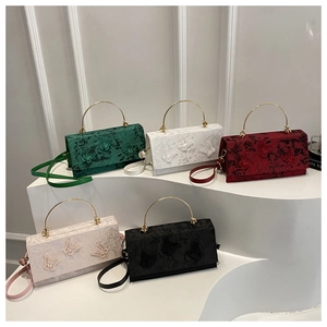 Detailed display of square crossbody bags in five colors with butterfly appliques and handles
